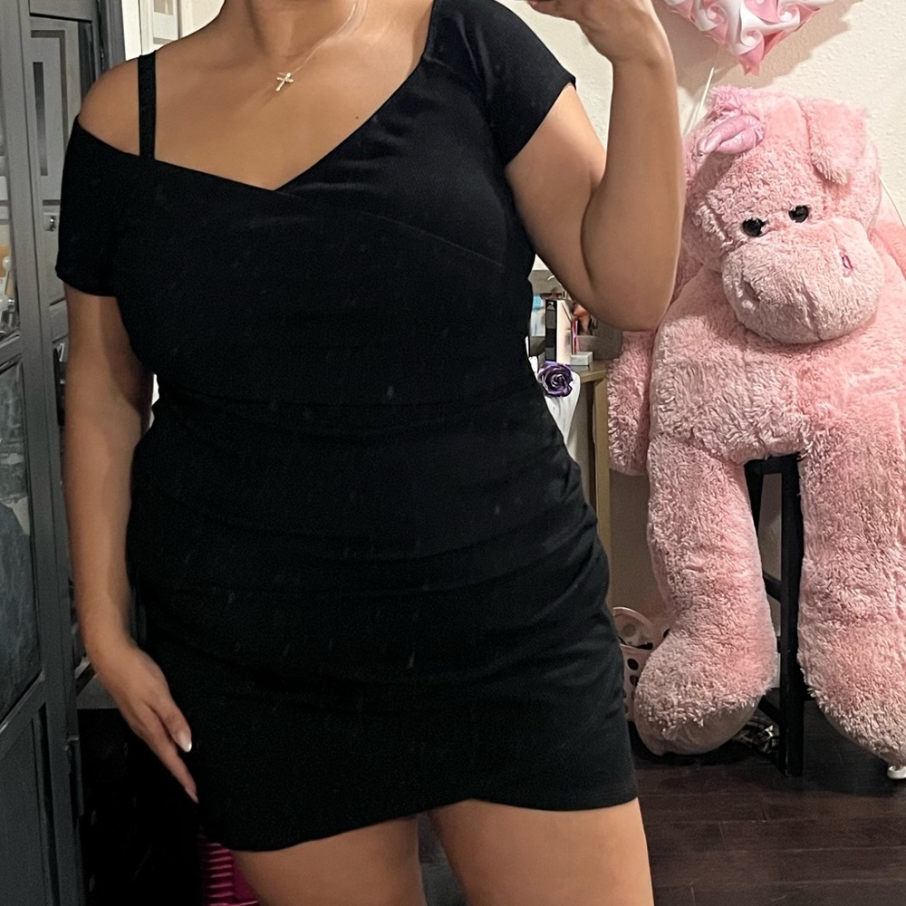 Black dress, has ruching on the front perfect for hiding the belly.